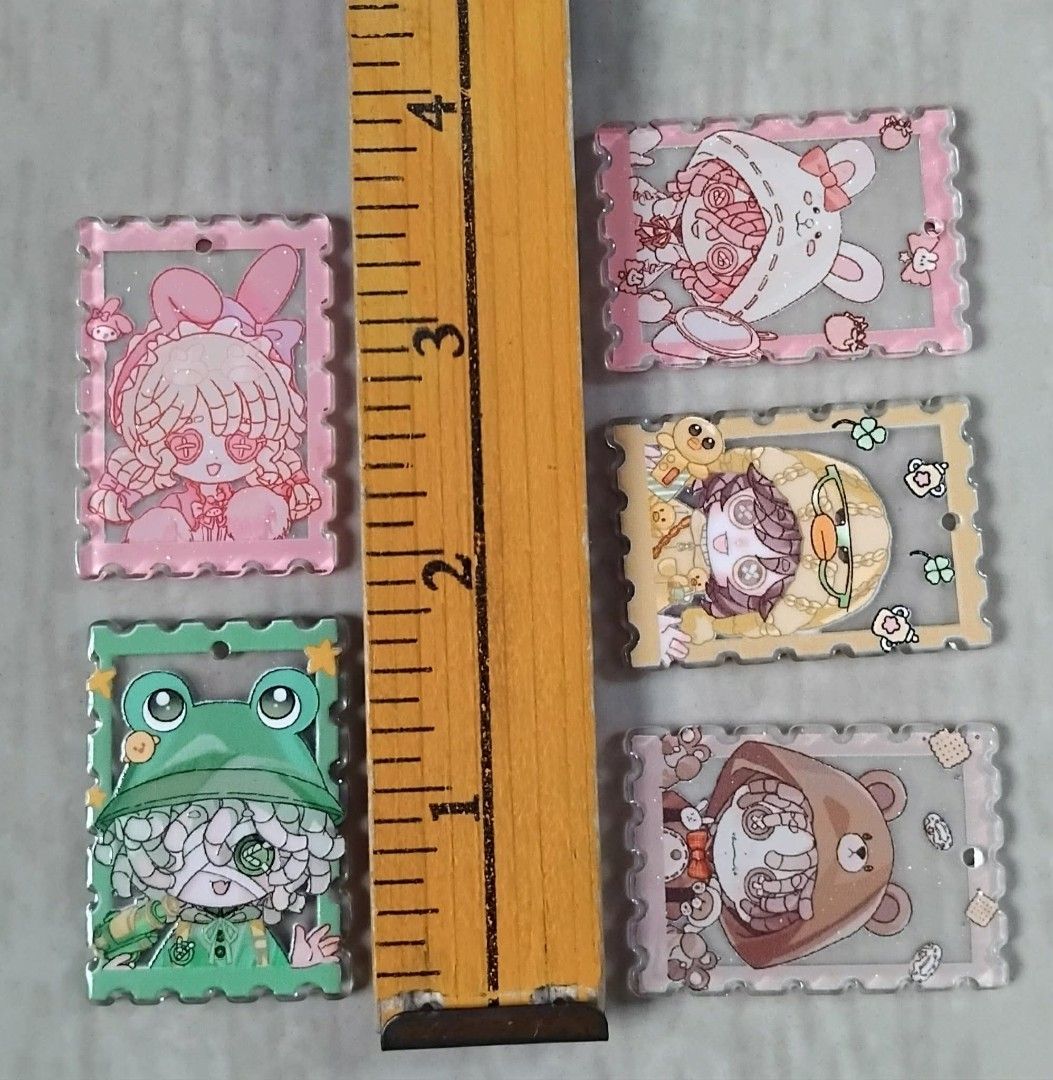 ASSORTED STAMP SHAPE CUTE ACRYLIC KEYCHAIN CHARMS SET (NEW) (Category: Character Goods) located in Cavite. Submitted by jiearah.online.shop (Listing ID 1439132352, Image 2). Description: ASSORTED STAMP SHAPE CUTE ACRYLIC KEYCHAIN CHARMS SET (NEW) Selling as Set. 5pieces EACH SET. 2 sets available. Can be use for making Keychains or Bag charms. With hole (Middle Top Part). One Side Embossed Surface. Selling as is. ACTUAL ITEM ON PHOTO. Please MANA