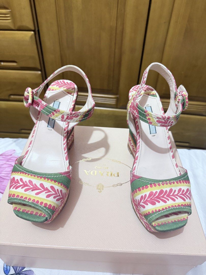Authentic Prada Wedge Sandals (Category: Sneakers & Footwear) located in Las Pinas. Submitted by danechanel (Listing ID 1439198086, Image 2). Description: - Authentic Prada wedge sandals - Eye-catching floral pattern - Secure ankle strap with buckle - Comes with original Prada box - Minor wear on soles - Used once - Last pic for your reference.