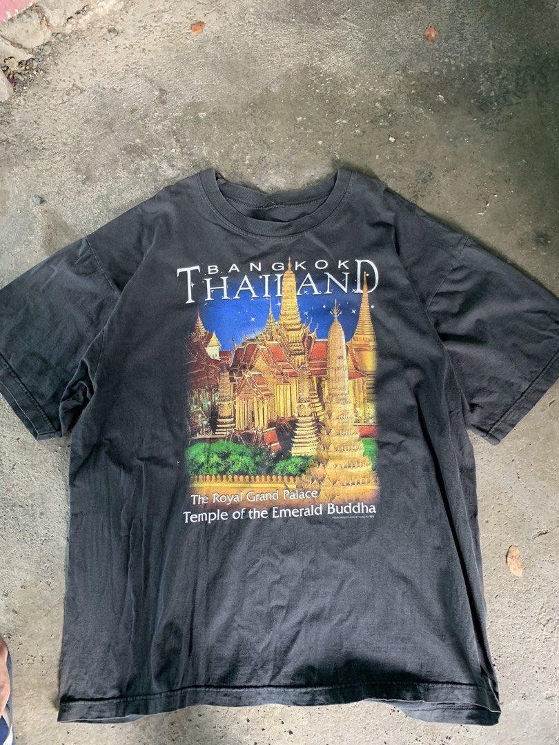 Bangkok Thailand Graphic Tee (Category: Tshirts & Polo Shirts ) located in Manila. Submitted by pole.thirft (Listing ID 1439107603, Image 1). Description: - Black t-shirt - Graphic print: Royal Grand Palace and Temple of the Emerald Buddha, Bangkok, Thailand - Text: "Bangkok Thailand" - Style: Crew neck, short sleeves - Fabric: Slightly faded.