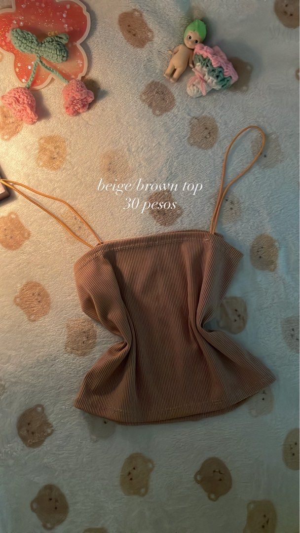 Beige/Brown Ribbed Top (Category: Sleeveless) located in Makati City. Submitted by kzisdeclutter (Listing ID 1439245753, Image 2). Description: - Beige/brown ribbed top - Features spaghetti straps - Simple and versatile design - Suitable for casual wear - Can be dressed up or down.