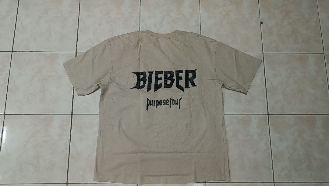 Bieber Purpose Tour T-shirt (Category: Tshirts & Polo Shirts ) located in Manila. Submitted by rmflores888 (Listing ID 1439114187, Image 2). Description: - Beige Bieber Purpose Tour shirt with front graphic and "BIEBER" on the back. - Black t-shirt with "CHILLIN' LIKE A VILLAIN" print. - Both shirts are short-sleeved..