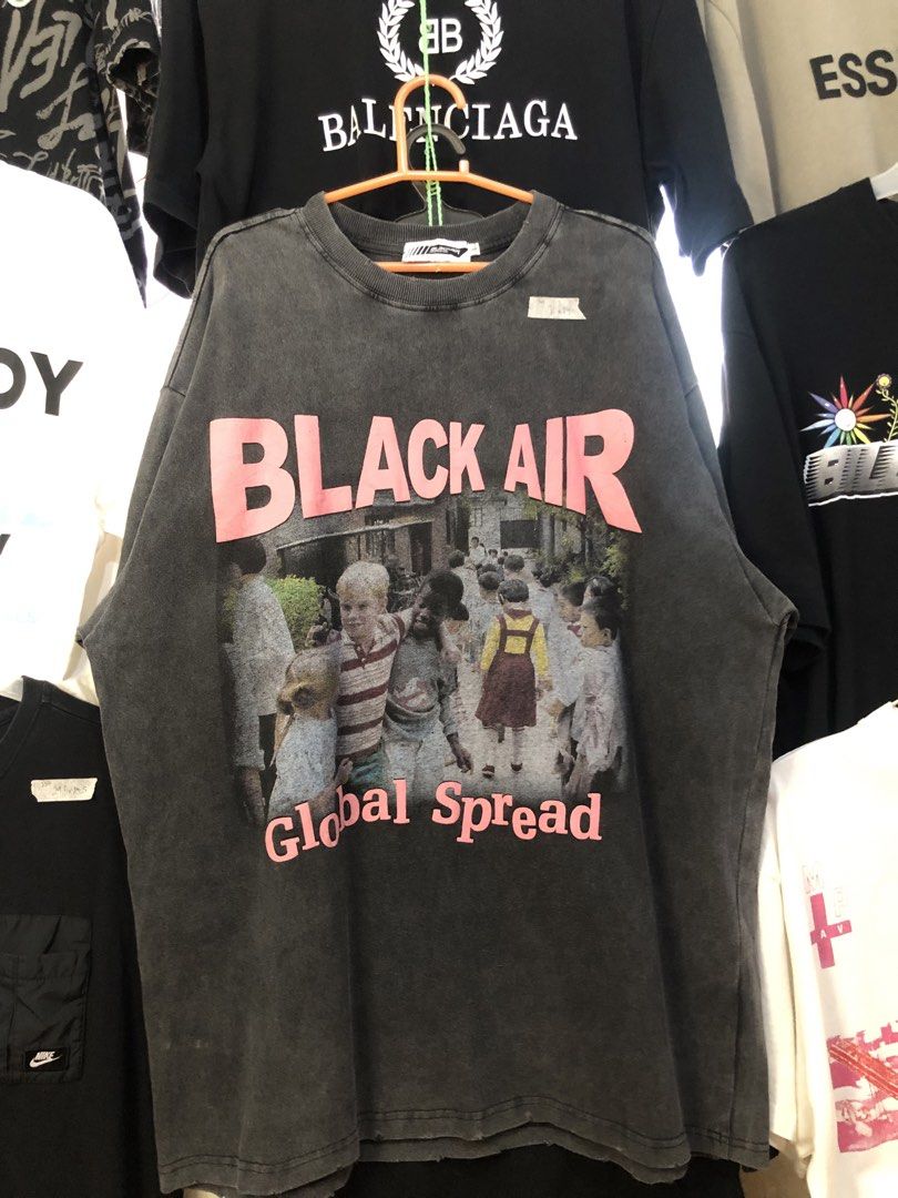 Black Air Global Spread Graphic Tee (Category: Tshirts & Polo Shirts ) located in Bulacan. Submitted by thrifted.master (Listing ID 1439148268, Image 1). Description: - Oversized black t-shirt - Features a "Black Air" graphic on the front - "Global Spread" text below the graphic - Back print includes album titles and years: - The College Dropout - 2004 - Late Registration - 2005 - Graduation - 2007 - 808s & Heartbreak - 2008 - Yeezus - 2013 - The