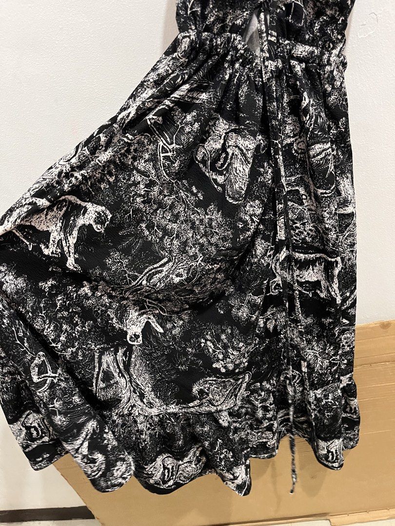 Black and White Printed Dress (Category: Dresses) located in Manila. Submitted by rhibosomes_ (Listing ID 1439236928, Image 3). Description: - Black and white print - V-neckline - Spaghetti straps - Cinched waist - Flowing skirt - Unique tie details - Knee-length - Perfect for casual or semi-formal events - backless No last price, DM for videos when worn.