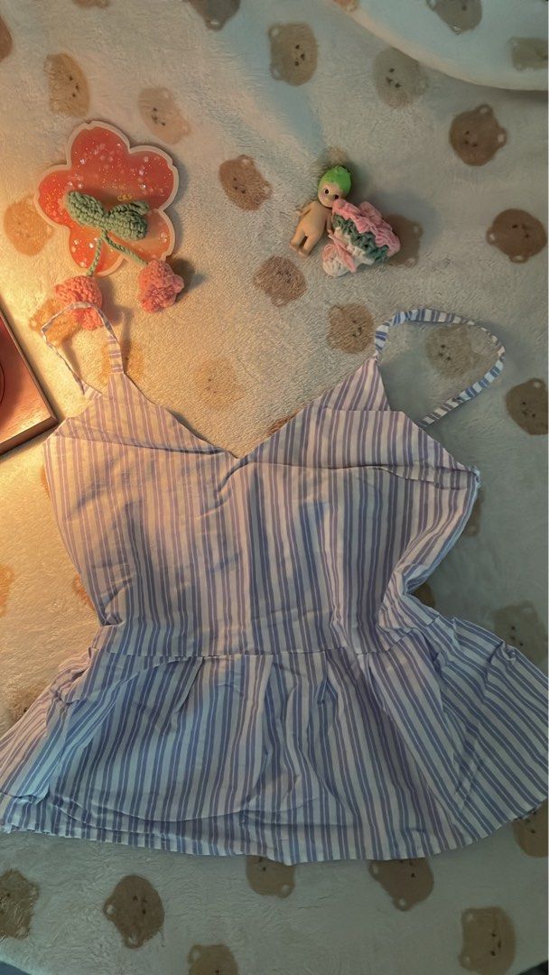 Blue and White Striped Top (Category: Blouses) located in Makati City. Submitted by kzisdeclutter (Listing ID 1439245862, Image 2). Description: - Blue and white striped pattern - V-neck design - Thin straps - Gathered waistline - Lightweight and comfortable - Perfect for warm weather - 80 pesos.