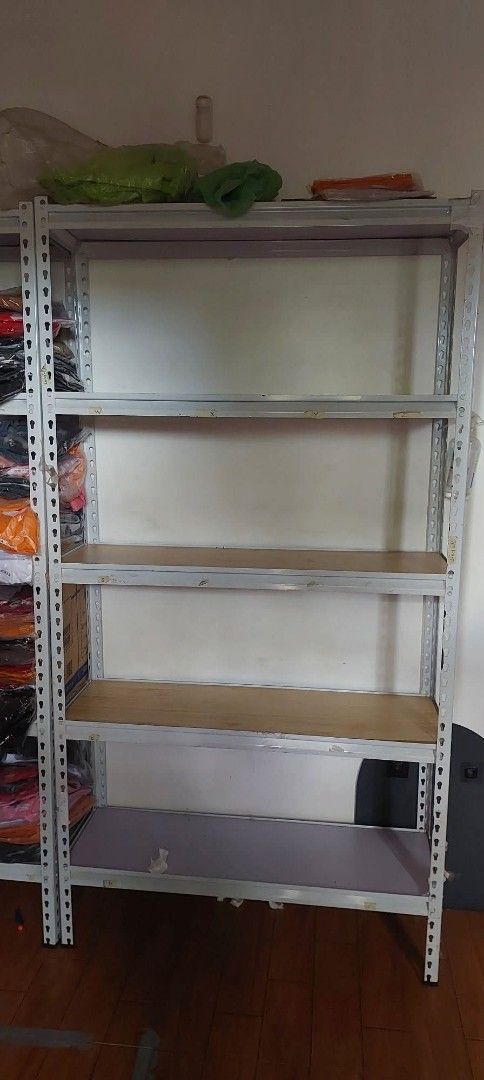 Bolyless Metal rack / Shelving Unit with 5 layers (Category: Shelves, Cabinets & Racks) located in Quezon City. Submitted by jedcob011229 (Listing ID 1439069267, Image 1). Description: - Sturdy metal shelving unit - Four shelves - Shelves appear to be wood or wood-like material - Ideal for storage room, garage, or extra storage - Provides ample storage space - Keeps items tidy and accessible - 100x30.