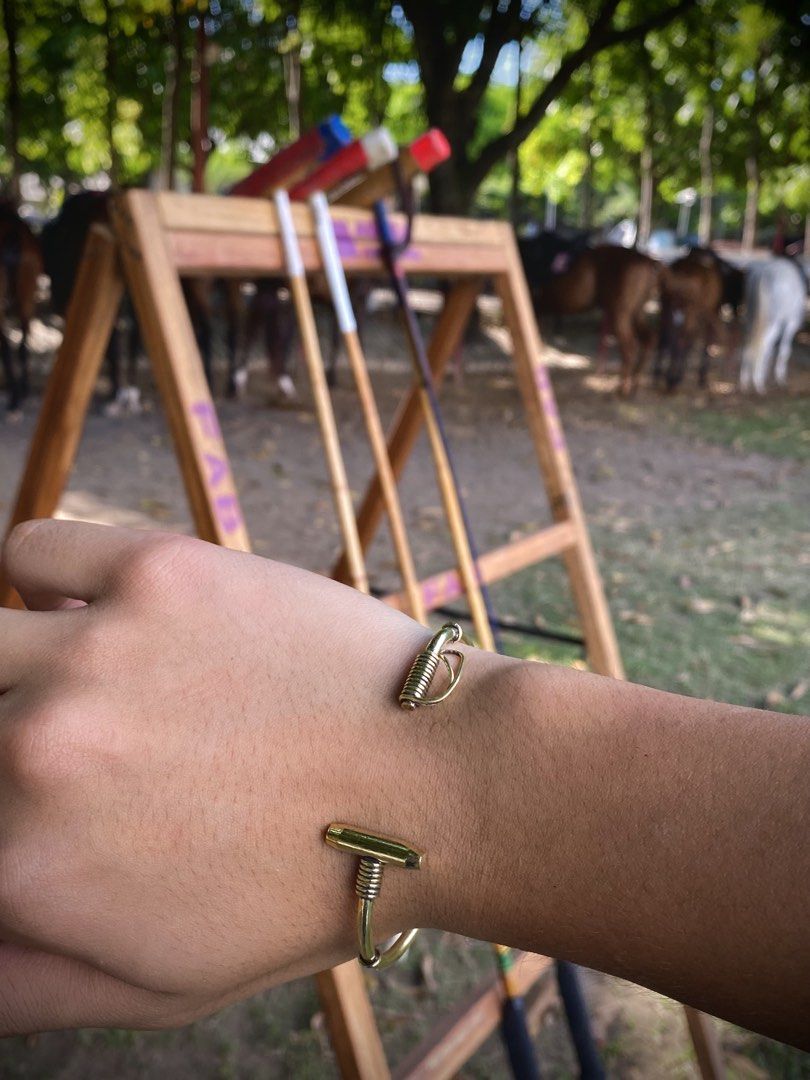 Brass Polo Mallet Bracelet (Category: Luxury Accessories) located in Pasig City. Submitted by momo_hiraiii (Listing ID 1439119168, Image 1). Description: Up your jewelry game! 🐎🧲 - 2 sizes - brand new - brass pm if interested!.