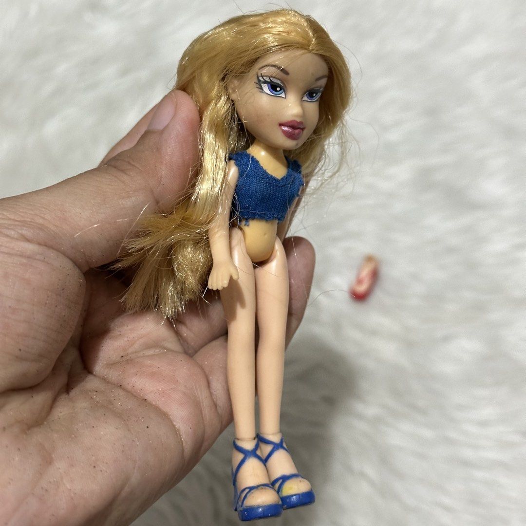 Bratz MINI Doll (Category: Kids Toys) located in Las Pinas. Submitted by thestylecapital (Listing ID 1439230567, Image 2). Description: BRATZ MINI DOLL - Miniature Bratz doll - Blonde hair and blue eyes - Blue denim top - Blue strappy heels (one missing) - Tan-colored body Selling as is. .