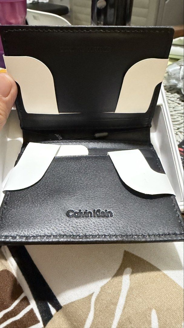 Calvin Klein Magnetic Reversible Card Case (Category: Wallets & Card holders) located in Marikina City. Submitted by Bosmic (Listing ID 1439212908, Image 3). Description: - Authentic / Bought in USA - Calvin Klein card case - Magnetic reversible design - Two looks in one - Made of leather - RFID protection - Protects cards from data theft - Sleek black design - Calvin Klein logo - Convenient card carrying.