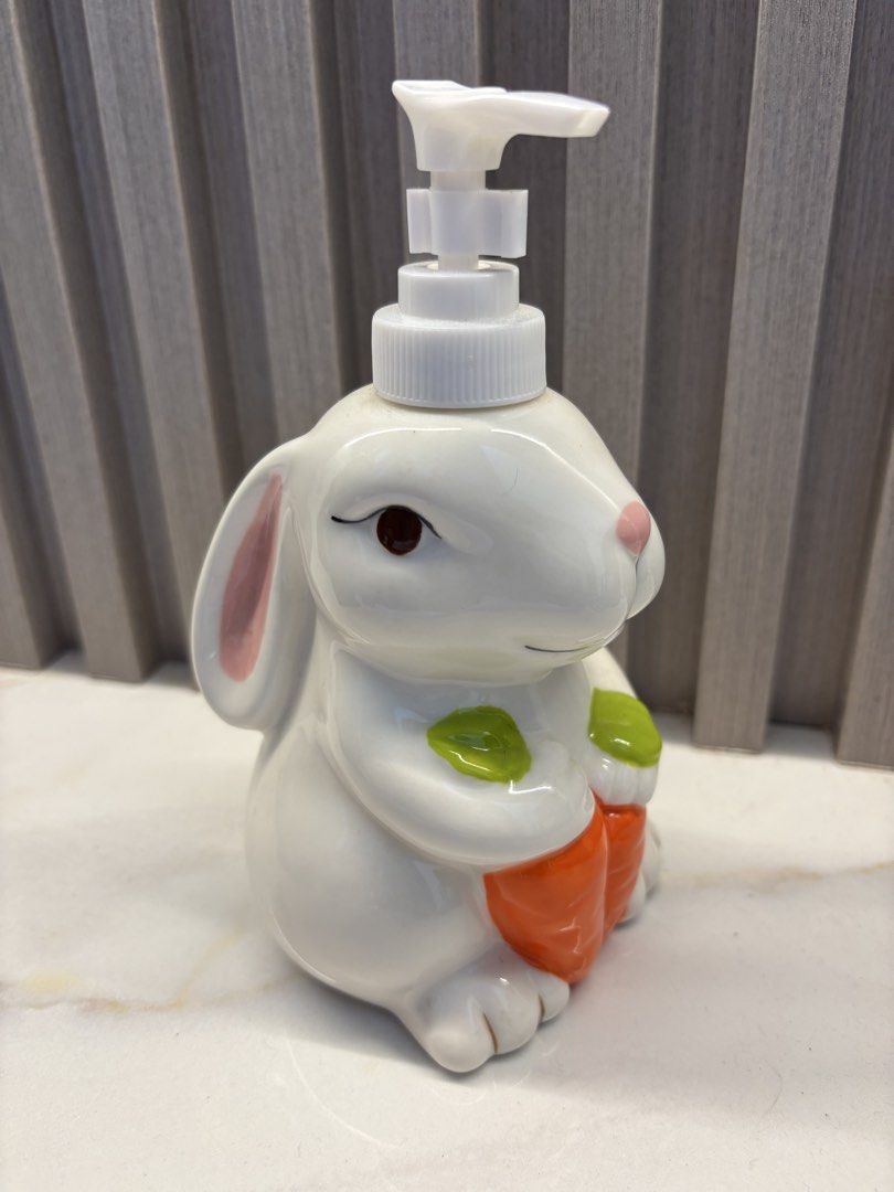 Ceramic Bunny Soap Dispenser (Category: Bath) located in Cavite. Submitted by ejp3773 (Listing ID 1439095457, Image 1). Description: - Adorable bunny-shaped soap dispenser. - Features a charming ceramic design. - Includes a white pump. - Detailed with pink ears and brown eyes. - Designed to hold liquid soap. - Perfect for bathroom or kitchen use. - never used. Displayed only..