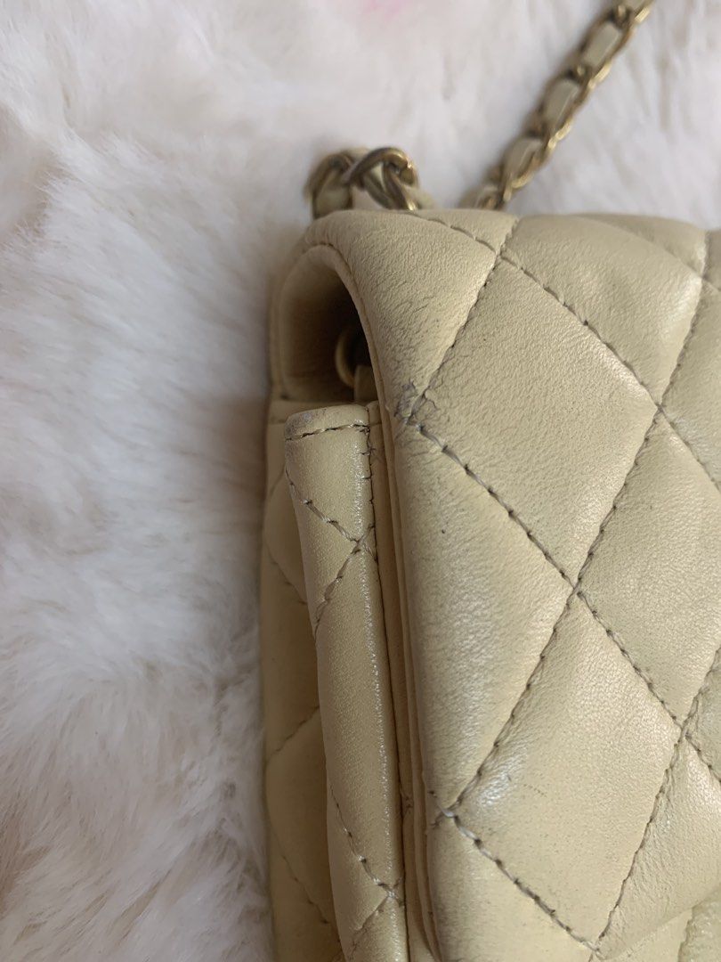 Chanel Quilted Mini Shoulder Bag (Category: Luxury Bags & Wallets) located in Manila. Submitted by _.d4awnn (Listing ID 1439109609, Image 3). Description: - Cream-colored Chanel shoulder bag - Quilted design - Gold-tone chain strap - Signature CC turn-lock closure - Features serial number sticker - Flap closure.