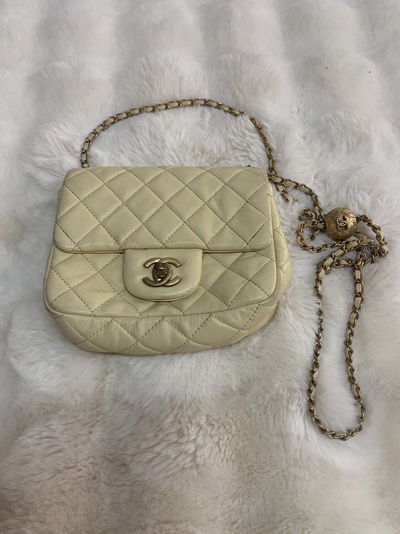 Chanel Quilted Mini Shoulder Bag (Category: Luxury Bags & Wallets) located in Manila. Submitted by _.d4awnn (Listing ID 1439109609, Image 1). Description: - Cream-colored Chanel shoulder bag - Quilted design - Gold-tone chain strap - Signature CC turn-lock closure - Features serial number sticker - Flap closure.