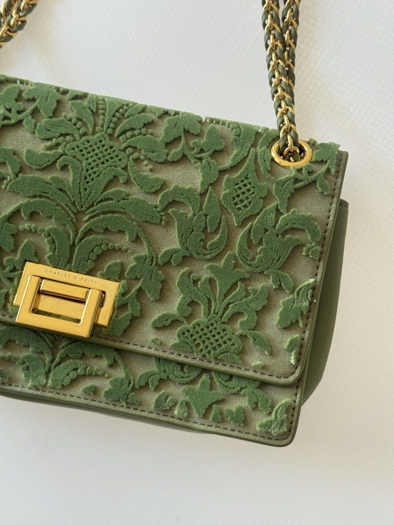 Charles & Keith Green Embroidered Shoulder Bag (Category: Shoulder Bags) located in Manila. Submitted by mpac22222 (Listing ID 1439131558, Image 2). Description: - Charles & Keith shoulder bag - Green color - Floral embroidery detail - Gold-tone chain strap - Rectangular gold-tone clasp - Velvet-like material - Rectangular shape.