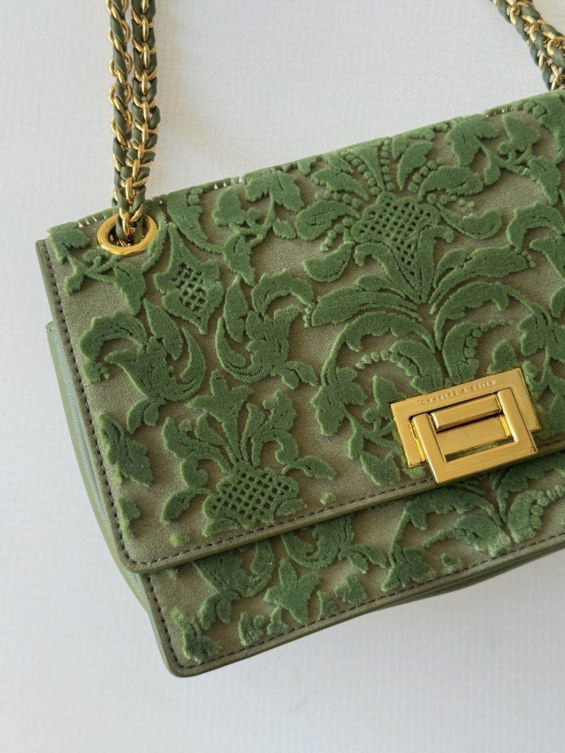 Charles & Keith Green Embroidered Shoulder Bag (Category: Shoulder Bags) located in Manila. Submitted by mpac22222 (Listing ID 1439131558, Image 3). Description: - Charles & Keith shoulder bag - Green color - Floral embroidery detail - Gold-tone chain strap - Rectangular gold-tone clasp - Velvet-like material - Rectangular shape.