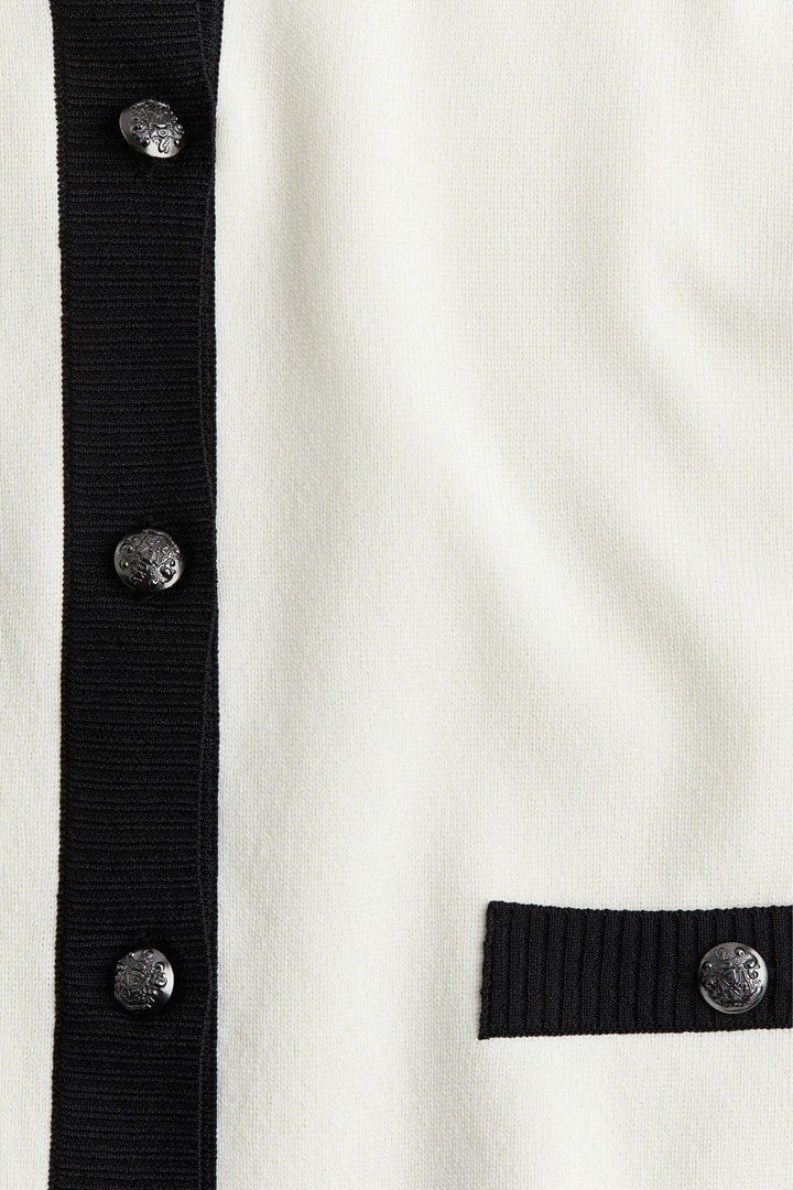 Cream and Black Cropped Cardigan (Category: Coats, Jackets and Outerwear) located in Quezon City. Submitted by _dcluttering (Listing ID 1439183240, Image 2). Description: - Cream-colored cropped cardigan - Black trim detailing - Round neckline - Long sleeves - Two front pockets - Decorative button closure.