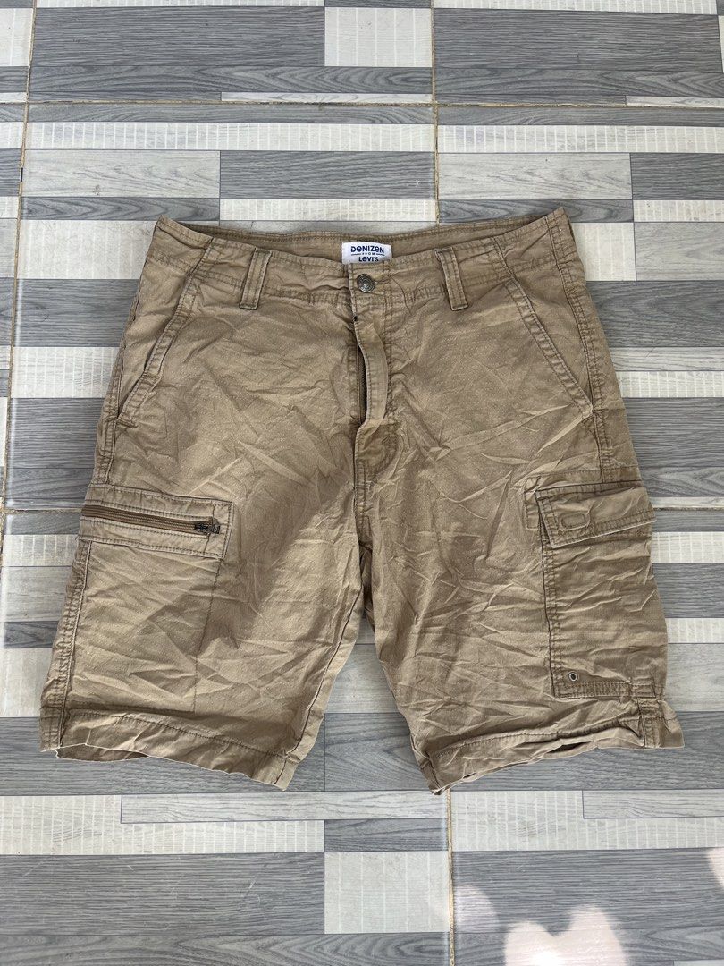 Denizen from Levi's Cargo Shorts (Category: Shorts) located in Sultan Kudarat. Submitted by c_jay28 (Listing ID 1439113734, Image 1). Description: - Denizen by Levi's cargo shorts - Size: 30 - Color: Brown - Features: - Multiple pockets - Zippered side pockets - Cargo pockets - Closure: Button and zipper - Style: Classic, casual.
