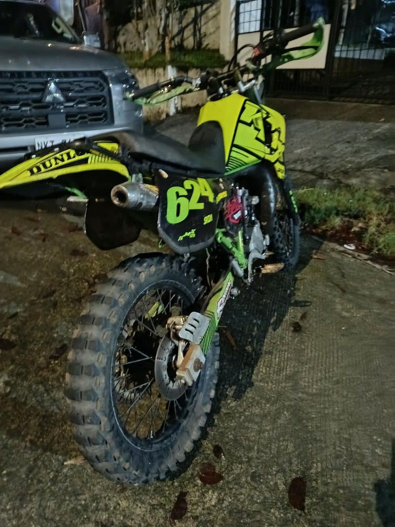 Dirt Bike Motorcycle (Category: Motorbikes for Sale) located in Caloocan City. Submitted by florespatrickjohntbk (Listing ID 1439085029, Image 3). Description: Dirt bike features a striking yellow and green color scheme. It has the number "624" displayed prominently. The bike has off-road tires and a Dunlop rear fender. It is suitable for off-road adventures..