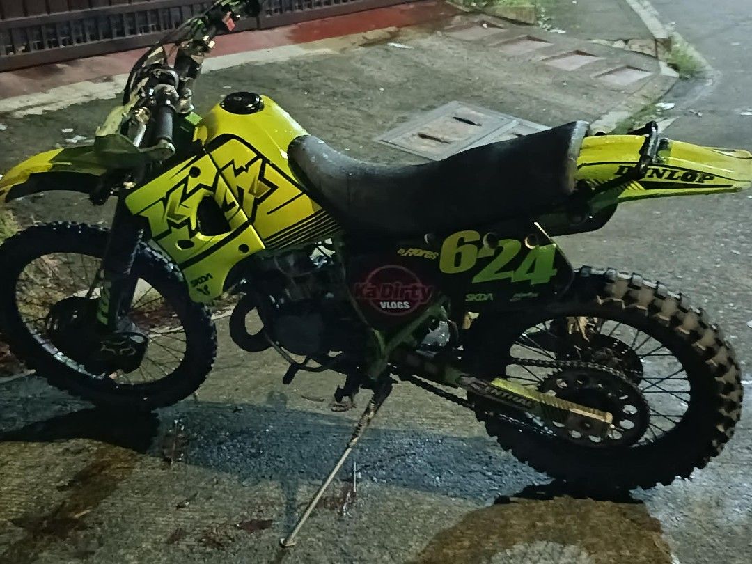 Dirt Bike Motorcycle (Category: Motorbikes for Sale) located in Caloocan City. Submitted by florespatrickjohntbk (Listing ID 1439085029, Image 1). Description: Dirt bike features a striking yellow and green color scheme. It has the number "624" displayed prominently. The bike has off-road tires and a Dunlop rear fender. It is suitable for off-road adventures..