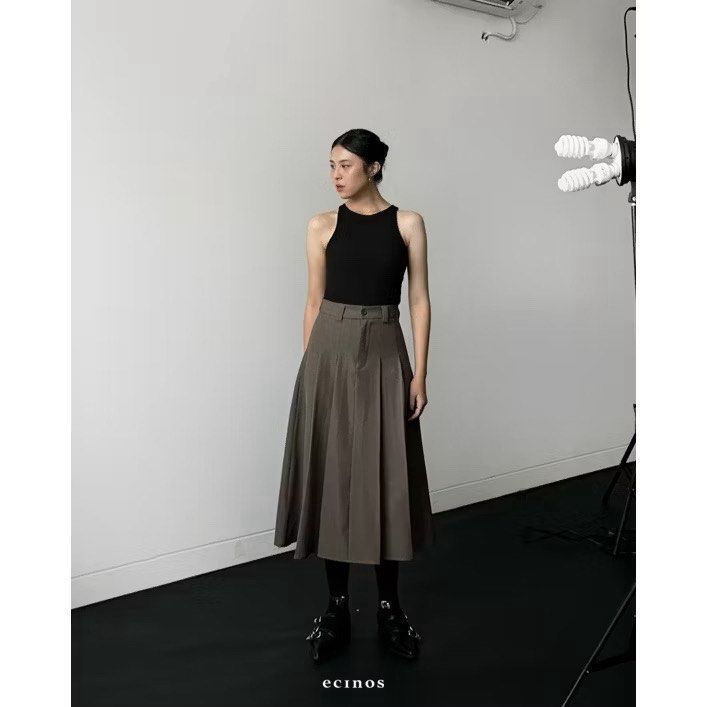 Ecinos Centuries Pleated Midi Skirt (Category: Skirts) located in Quezon City. Submitted by fuzzyrat (Listing ID 1439246743, Image 1). Description: - Neutral-colored midi skirt - Pleated design - Tailored fit - Button and zipper closure - Mid-calf length - Perfect for casual and semi-formal outfits.