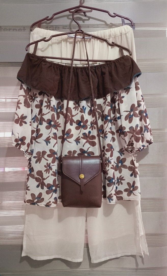 Floral Off-Shoulder Top with Pants and Bag (Category: Sets or Coordinates) located in Rodriguez. Submitted by maycol (Listing ID 1439076721, Image 2). Description: - Floral off-shoulder top with brown and blue accents - Cream-colored pants with button details - Small brown crossbody bag - Ideal for casual wear.