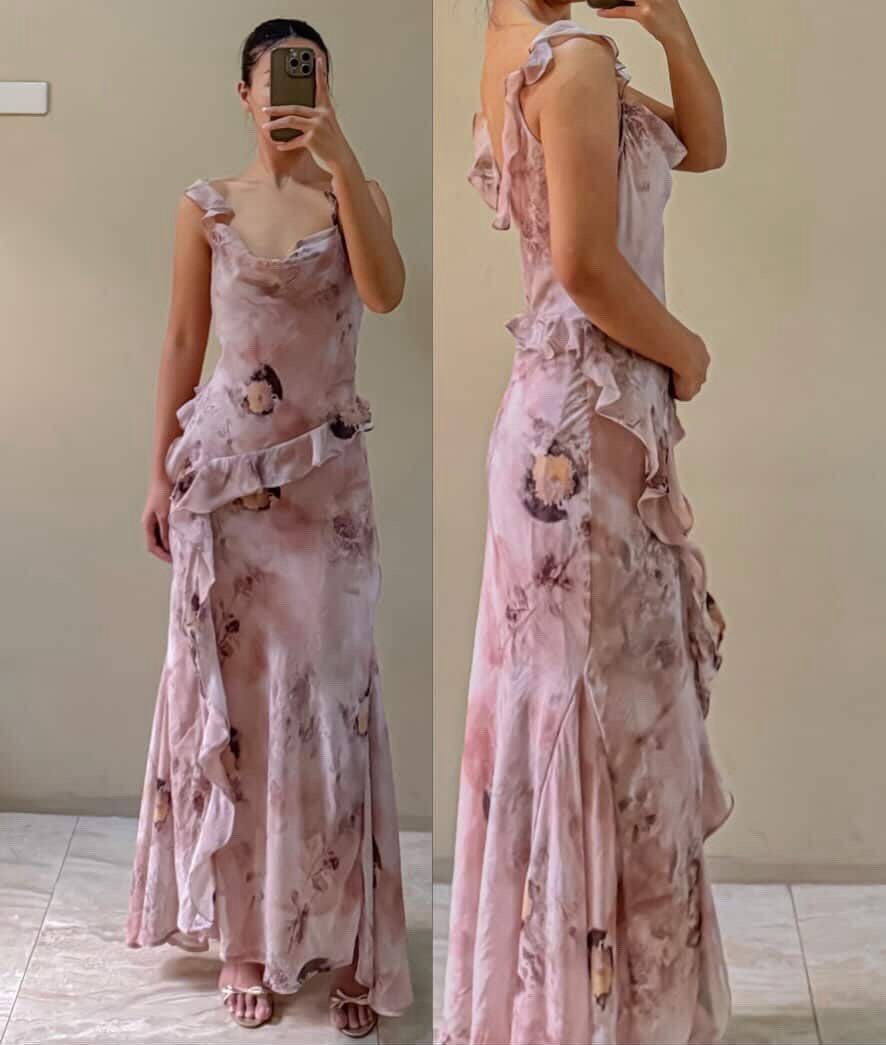 Floral Ruffle Maxi Dress (Category: Dresses) located in Cainta. Submitted by tshopper (Listing ID 1439077469, Image 3). Description: - Elegant floral maxi dress - Flattering silhouette - Fitted bodice - Flowing skirt - Ruffle details on neckline and skirt - Ideal for special occasions and evening events B: 28-33” W:25-27” L:59”.