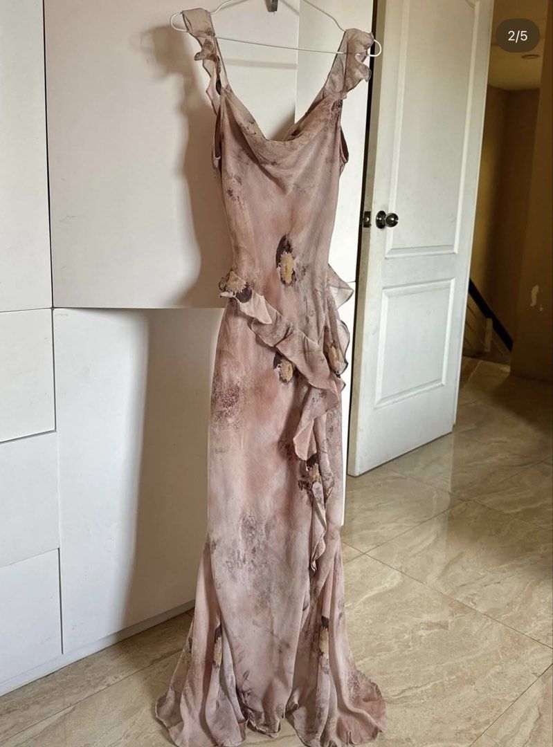 Floral Ruffle Maxi Dress (Category: Dresses) located in Cainta. Submitted by tshopper (Listing ID 1439077469, Image 1). Description: - Elegant floral maxi dress - Flattering silhouette - Fitted bodice - Flowing skirt - Ruffle details on neckline and skirt - Ideal for special occasions and evening events B: 28-33” W:25-27” L:59”.