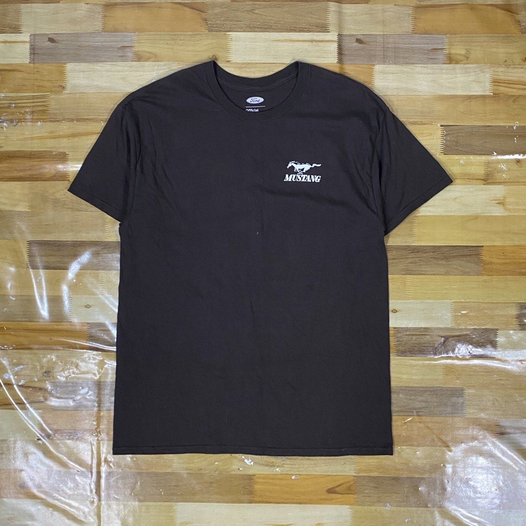 Ford Mustang 1966 Graphic Tee (Category: Tshirts & Polo Shirts ) located in Cebu City. Submitted by cjakosalem02 (Listing ID 1439213572, Image 2). Description: - Official Ford licensed t-shirt - Features a 1966 Mustang graphic on the back - Small Mustang logo on the front - Color: Brown - Size: L - Brand: Hybrid Apparel - Made in Dominican Republic.