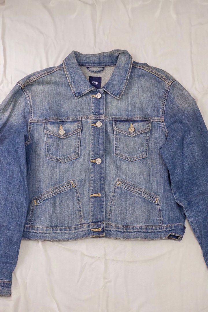 Gap Denim Jacket (Category: Coats, Jackets and Outerwear) located in Marikina City. Submitted by pau.buenviaje (Listing ID 1439130470, Image 2). Description: - Gap denim jacket - Light blue wash - Button-down front - Collared neckline - Long sleeves - Two chest pockets - Two side pockets - Gap logo on inside label.