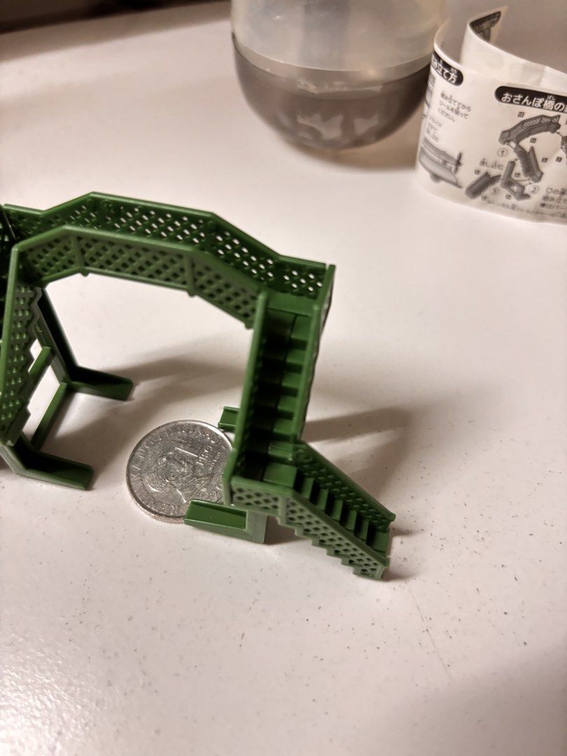 Gashapon Miniature Green Bridge (Category: Designer & Blind Box Toys) located in Pasay City. Submitted by tindeclutterstuff (Listing ID 1439149703, Image 2). Description: - Miniature green bridge - Ideal for model train sets or dioramas - Features detailed stairways and textured surface - Comes with original capsule and instructions - Coin included for size reference - Collectible item #gashapon #diorama #dioramatoys #dioramaminis .