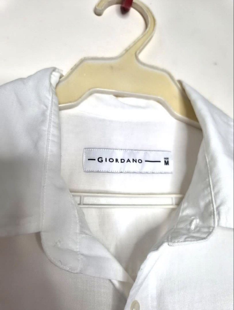 Giordano White Long Sleeve Shirt - Medium (Category: Tshirts & Polo Shirts ) located in Manila. Submitted by joyobaldo158861 (Listing ID 1439132734, Image 2). Description: - Giordano white long sleeve shirt - Size: Medium - Features: - Button-down front - Chest pocket - Buttoned cuffs - Classic collar - Lightweight fabric - Suitable for casual and semi-formal occasions.