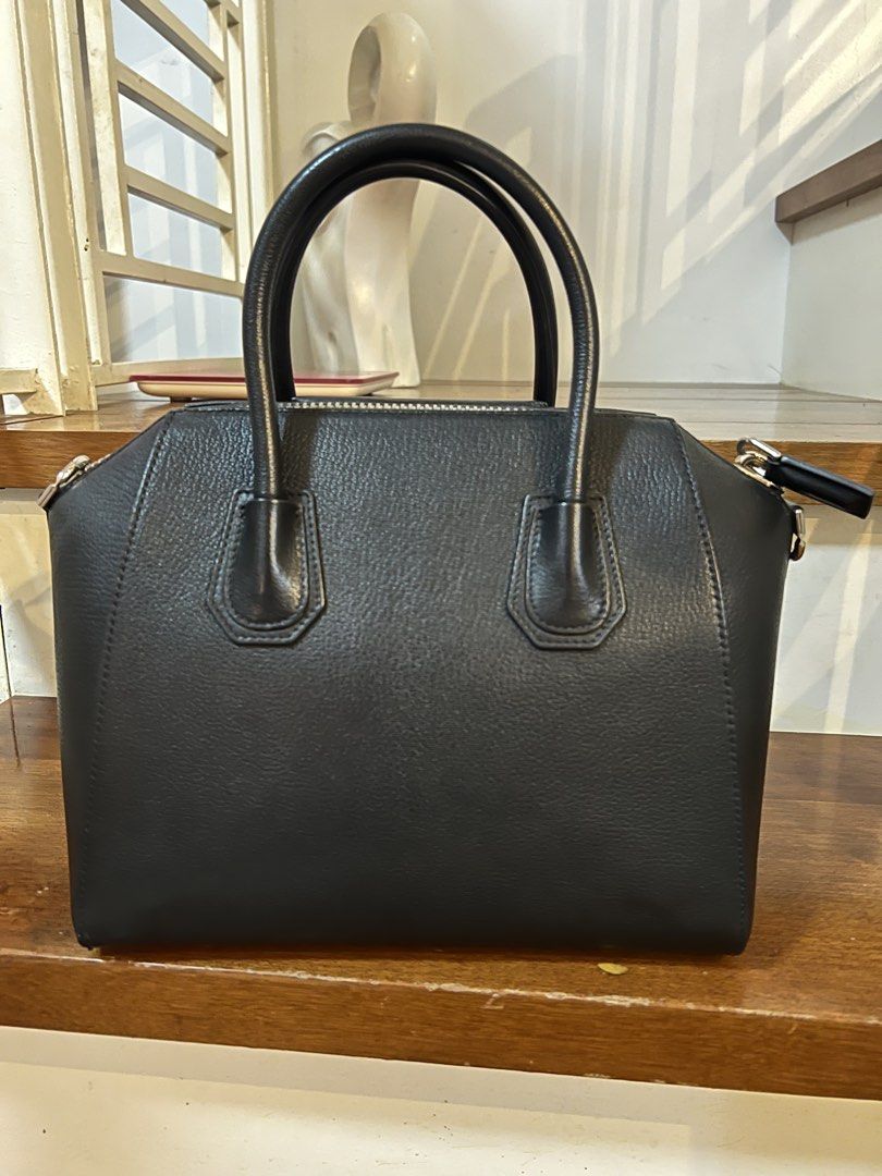 Givenchy Antigona Small Black Handbag (Category: Luxury Bags & Wallets) located in San Fernando. Submitted by rcrxoxo (Listing ID 1439221158, Image 2). Description: - Authentic Givenchy Antigona handbag - Classic black color - Structured silhouette - Top handle and detachable shoulder strap - Secure zippered closure - Iconic Givenchy logo - Textured leather finish - With removable strap, cards, leather swatch, and dust bag.