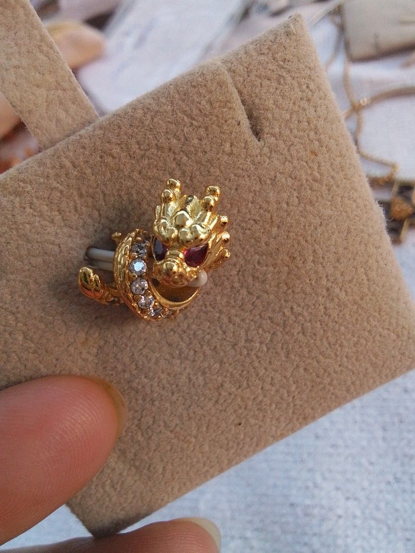 Gold Dragon Brooch with Gemstones (Category: Precious Stones) located in Manila. Submitted by sakinto (Listing ID 1439135626, Image 1). Description: - Gold dragon pendant9 - Features ruby and clear crystal gemstones - Intricate detailing - Secure pin backing - Adds elegance to any outfit 925.