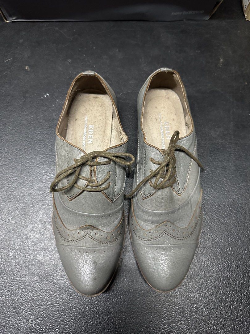 Grey Leather Oxford Shoes (Category: Casual Shoes) located in Quezon City. Submitted by plzdeclutter (Listing ID 1439216958, Image 2). Description: - Grey leather wingtip oxford shoes - Lace-up closure - Classic wingtip design with decorative perforations - Low heel - Textured sole - Dark green laces - Visible interior lining - Well-worn condition -Size 5 W.