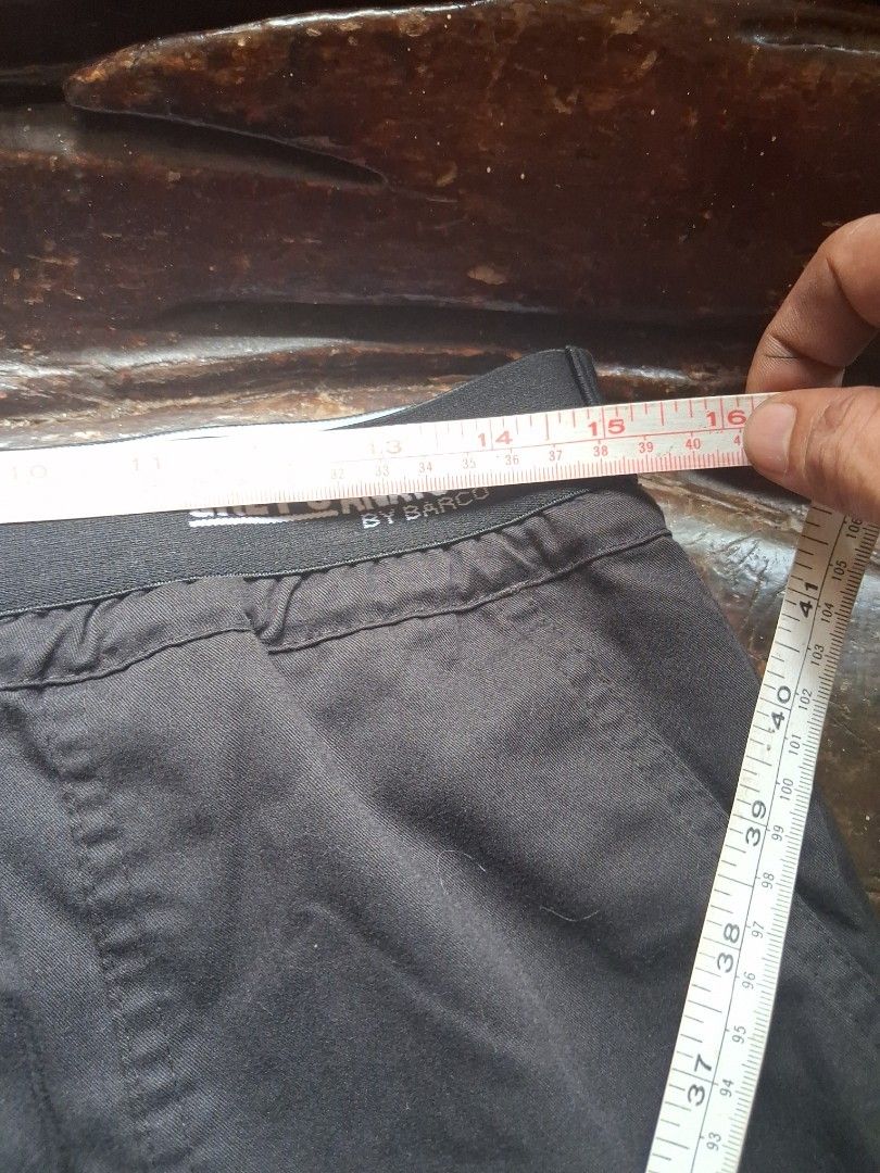 Grey's Anatomy Black Scrub Pants (Category: Other Bottoms) located in Manila. Submitted by beardedbot (Listing ID 1438914475, Image 2). Description: Black scrub pants from Grey's Anatomy. Features a drawstring waist. The pants appear to be made of a durable fabric. The pants are laid flat on a light blue surface. The Grey's Anatomy logo is visible on the waistband..