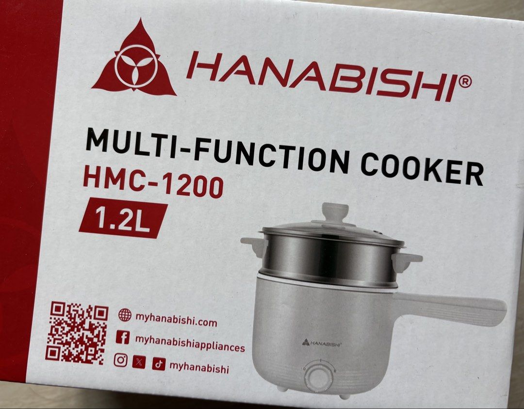 Hanabishi Multi-Function Cooker HMC-1200 1.2L (Category: Cookers) located in Pasay City. Submitted by silvertree_121397 (Listing ID 1439141228, Image 1). Description: - Hanabishi Multi-Function Cooker HMC-1200 - 1.2L capacity - Includes steamer attachment - White body - Features a handle and control knob - Brand new, in box.