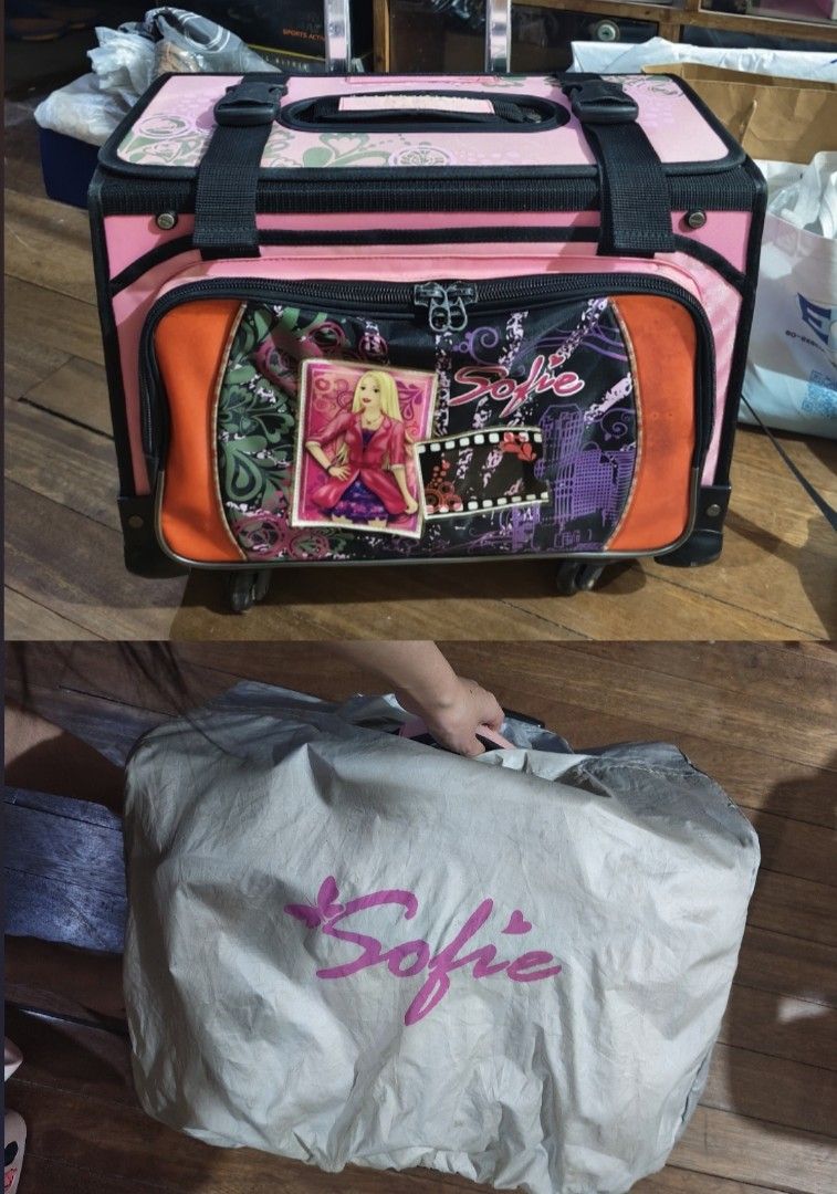 Hawk Sofie trolley boxtype school bag (Category: Strollers) located in Bulacan. Submitted by angel.decluttersx (Listing ID 1439201140, Image 1). Description: ✅all zippers, wheels, trolley handle, and the garter of cover bag are still working well ✅ spacious with sturdy trolley handle ✅still usable and functional for school flaw: minimal discoloration and visible signs of usage ng handle and missing bottle water handle sa side ng bag dm if interes