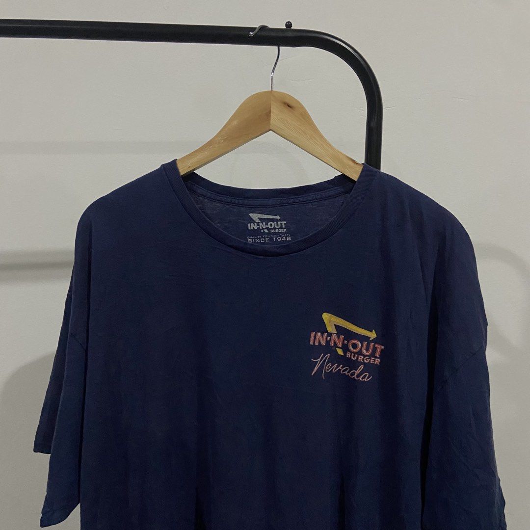 In-N-Out Burger Nevada Graphic Tee (Category: Tshirts & Polo Shirts ) located in Balungao. Submitted by kupaloots_club (Listing ID 1439151279, Image 2). Description: - Navy blue In-N-Out Burger graphic tee. - Features front logo with "Nevada" text. - Back graphic with cars and restaurant scene. - Crew neck and short sleeves. - Made of soft material. - Ideal for casual wear..