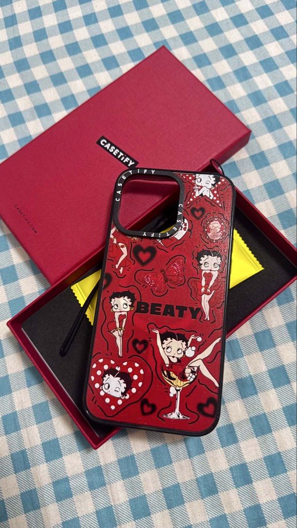 IPHONE 15 PRO MAX Casetify Betty Boop Case (Category: Cases & Sleeves) located in Cavite. Submitted by jam90053 (Listing ID 1439246839, Image 1). Description: - Casetify iPhone case - Features a Betty Boop design - Red color - Includes original box - Designed for a specific iPhone model (check camera cutout).