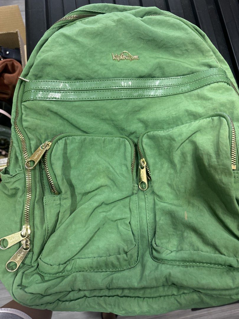 Kipling Green Backpack (Category: Backpacks) located in Quezon City. Submitted by madampat (Listing ID 1439165820, Image 1). Description: - Green Kipling backpack - Multiple zippered compartments - Top handle - Adjustable shoulder straps - Light beige interior - Small interior pocket - Gold-finished zippers - Kipling logo on front.