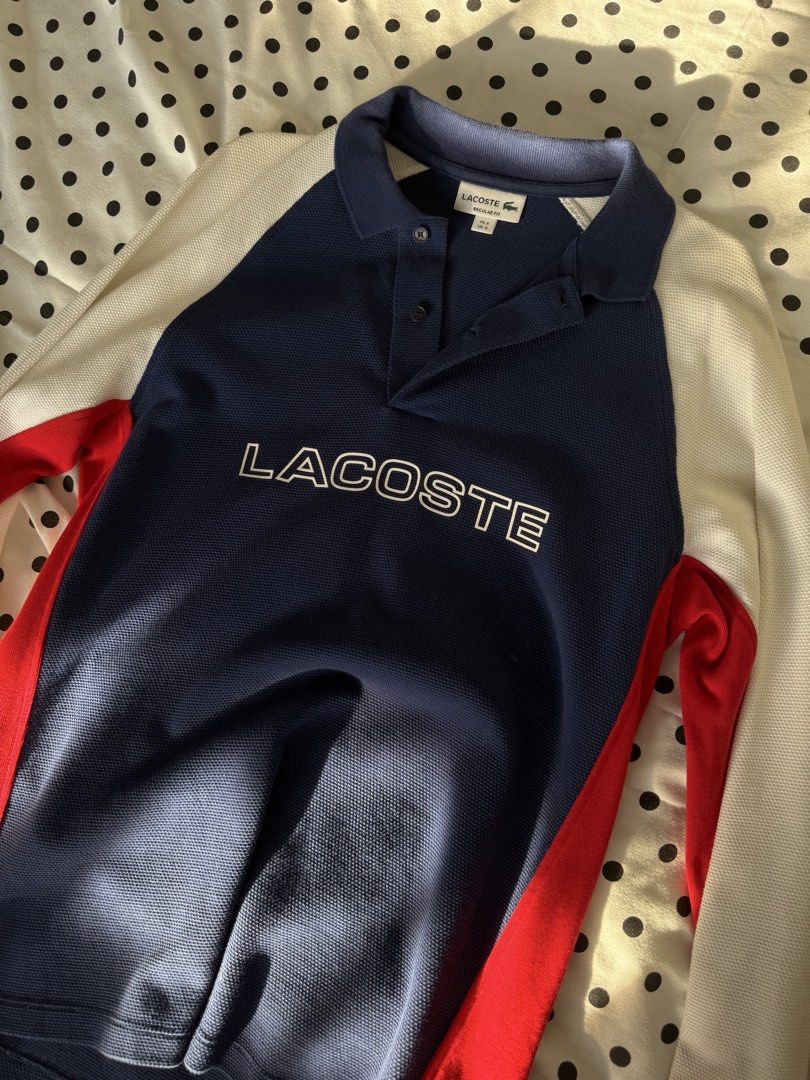 Lacoste Long Sleeve Polo Shirt (Category: Tshirts & Polo Shirts ) located in Quezon City. Submitted by kyudotcom (Listing ID 1439157245, Image 1). Description: - Lacoste long sleeve polo shirt - Color: Navy blue, red, and white - Features Lacoste logo - Collared neckline with buttons - Size: FR 3 / US 6 - Fit: Regular.