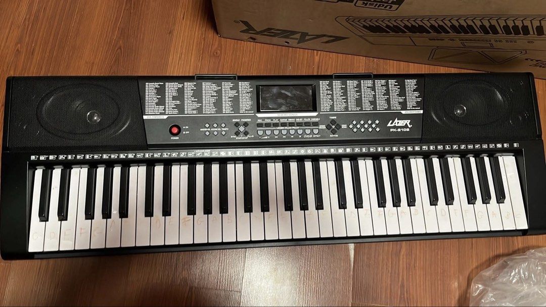 Lazer PK-2102 Piano Keyboard (Category: Musical Instruments) located in Quezon City. Submitted by alphonse13 (Listing ID 1439154709, Image 1). Description: LAZER PK-2102 Keyboard 🎹 Price is fixed. RFS: My sister barely used it and it’s just been sitting at home. Bought around Q4 2025. Complete with original box and power adapter as seen in photos. Working perfectly with speakers, buttons, and keys tested. The handwritten note labels on some keys