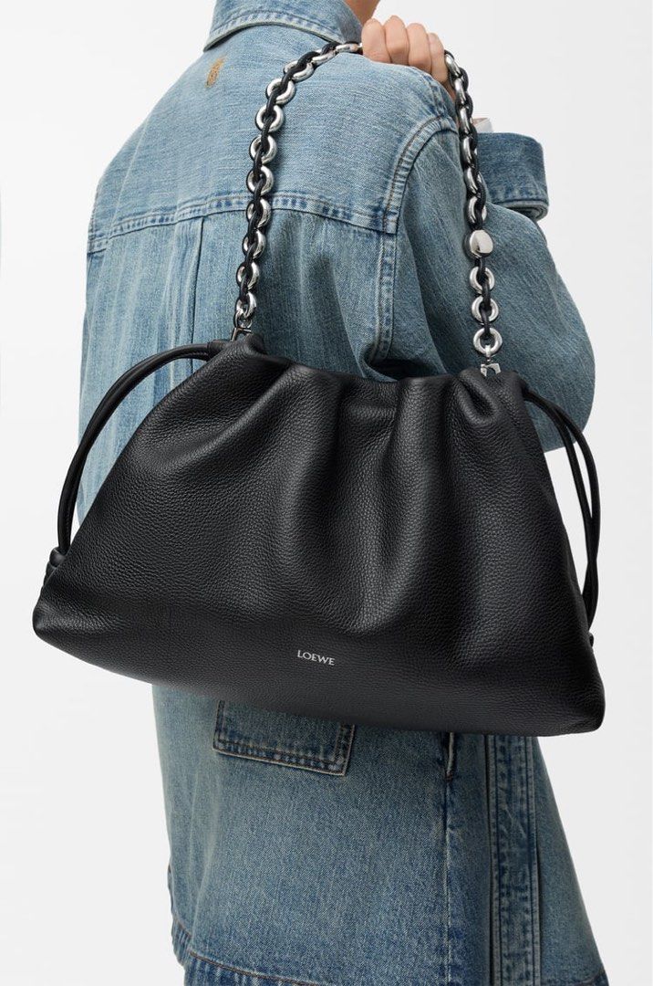 ⚜️Loewe Flamenco large bag (Category: Luxury Bags & Wallets) located in Makati City. Submitted by 90sangel (Listing ID 1439061630, Image 1). Description: •Item: Loewe Flamenco clutch bag in black grained calfskin 🤍 •Size: Large 🍂 •Condition: Excellent! *Very soft and slouchy bag with a cinched closure and knot drawstrings. 🍂🤍 Can wear Shoulder, crossbody or hand carry Detachable and adjustable strap. Includes dustbag + big loewe paperbag.