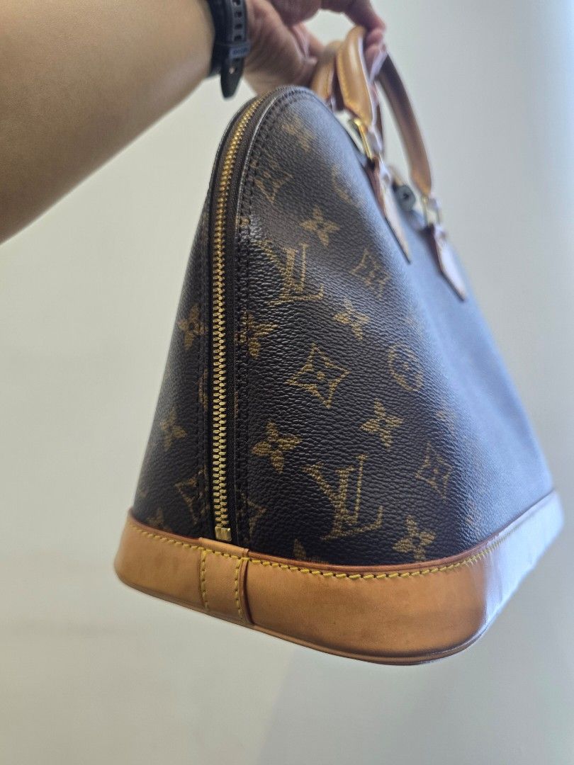 Louis Vuitton Alma PM Monogram Coated Canvas Bag (Category: Luxury Bags & Wallets) located in Taguig. Submitted by mluxeph (Listing ID 1439076596, Image 3). Description: Louis Vuitton Alma PM Monogram Coated Canvas Bag Material: Coated canvas and cowhide leather Stamp: BA0977 Year: 1997 Interior: One main compartment and one open pocket Measurements: 12.6"L X 6.3"W X 9.8"H Handle Drop: 3.6" Hardware: Gold tone Inclusions: Original dust bag and pa