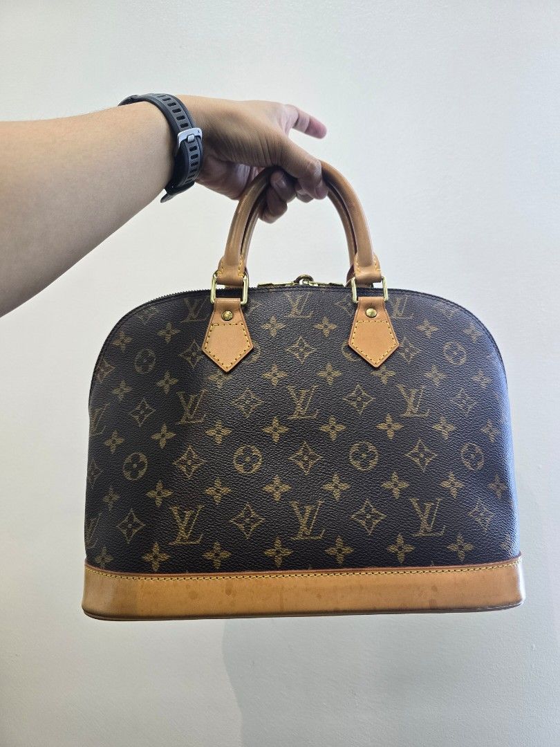 Louis Vuitton Alma PM Monogram Coated Canvas Bag (Category: Luxury Bags & Wallets) located in Taguig. Submitted by mluxeph (Listing ID 1439076596, Image 1). Description: Louis Vuitton Alma PM Monogram Coated Canvas Bag Material: Coated canvas and cowhide leather Stamp: BA0977 Year: 1997 Interior: One main compartment and one open pocket Measurements: 12.6"L X 6.3"W X 9.8"H Handle Drop: 3.6" Hardware: Gold tone Inclusions: Original dust bag and pa
