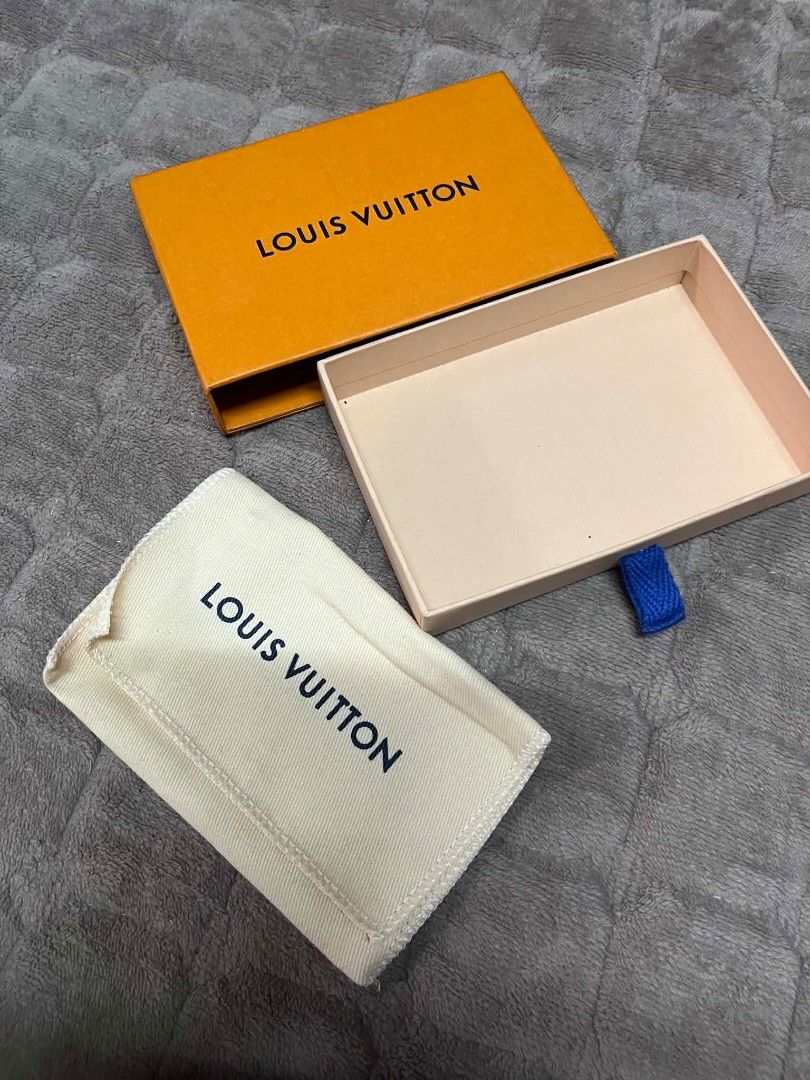 Louis Vuitton Box and Dust Bag (Category: Luxury Bags & Wallets) located in Quezon City. Submitted by delacruzara (Listing ID 1439197426, Image 1). Description: Authentic Louis Vuitton box and dust bag. The box is orange with the Louis Vuitton logo. The dust bag is white with the Louis Vuitton logo. Includes the original box and dust bag. Perfect for storing small accessories or as a replacement..