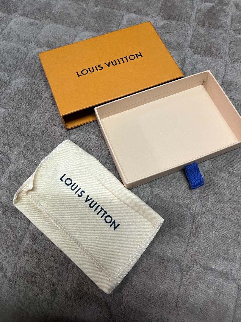 Louis Vuitton Box and Dust Bag (Category: Luxury Bags & Wallets) located in Quezon City. Submitted by delacruzara (Listing ID 1439197426, Image 2). Description: Authentic Louis Vuitton box and dust bag. The box is orange with the Louis Vuitton logo. The dust bag is white with the Louis Vuitton logo. Includes the original box and dust bag. Perfect for storing small accessories or as a replacement..