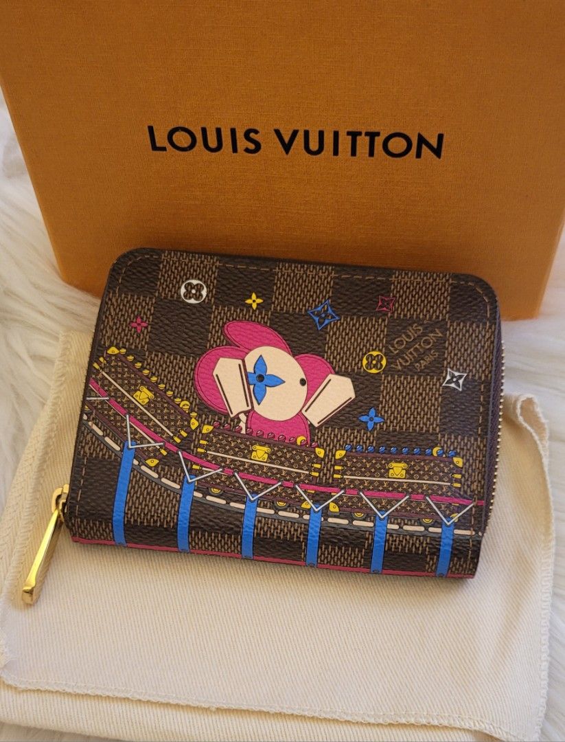Louis Vuitton Compact Zip Vivienne (Category: Luxury Bags & Wallets) located in Quezon City. Submitted by bagsplusmore (Listing ID 1439248525, Image 1). Description: - Authentic Louis Vuitton zip wallet - Iconic Damier Ebene canvas - vivienne collection - Vibrant pink interior - Includes original box and dust bag - Multiple card and cash compartments .