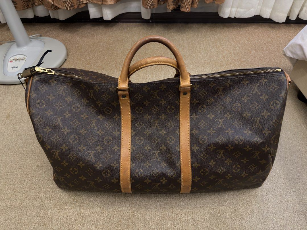 Louis Vuitton Keepall Bandouliere 60 (Category: Luxury Bags & Wallets) located in Cebu City. Submitted by kentyves4464 (Listing ID 1439183451, Image 1). Description: - Louis Vuitton Keepall Bandouliere 55 - Iconic Monogram canvas - Leather handles and trim - Detachable shoulder strap - Top zip closure - Spacious interior - Well-maintained condition - Ideal for travel and everyday use.