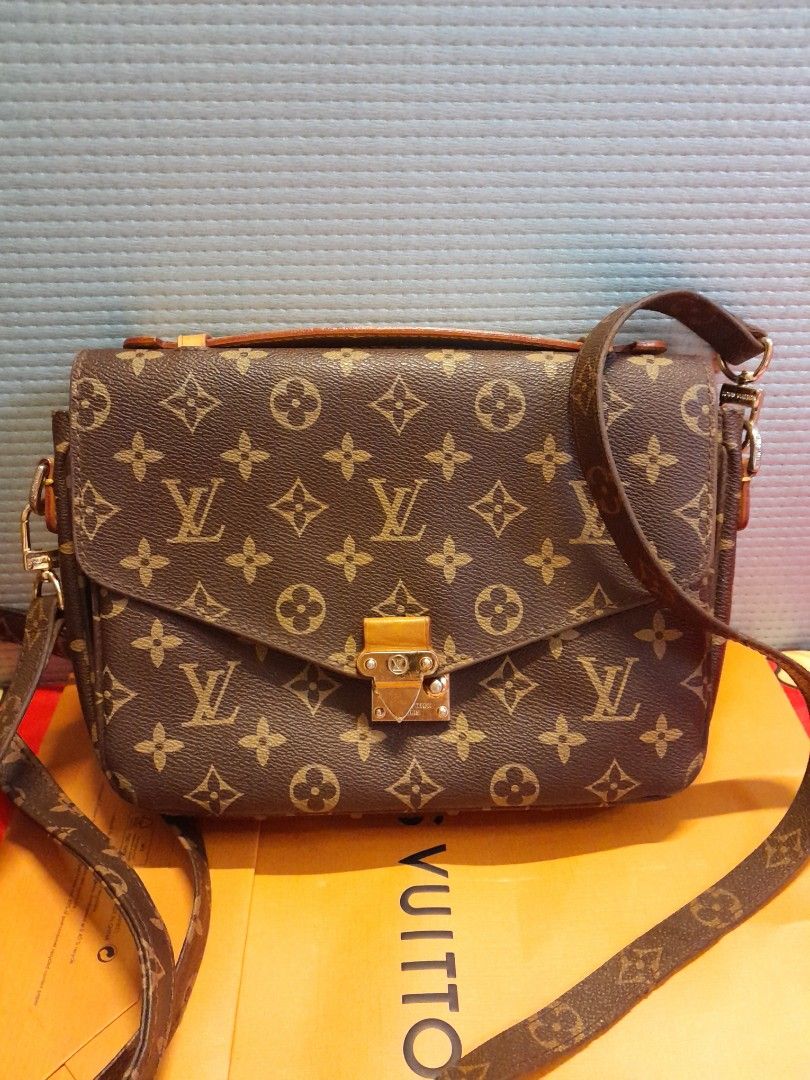 Louis Vuitton Monogram Crossbody Bag (Category: Bags & Wallets) located in Singapore. Submitted by vastcloud_ea17aa (Listing ID 1439098259, Image 3). Description: Louis Vuitton crossbody bag - Classic monogram canvas - Gold-tone clasp closure - Detachable shoulder strap - Top handle - Includes original shopping bag - Perfect for everyday use.