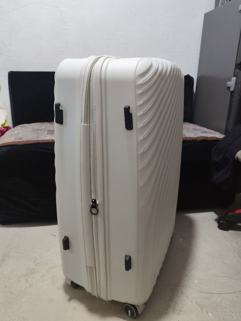 LUD URBAN White Luggage (Category: Luggage) located in Taytay. Submitted by PrelovedCollections (Listing ID 1439134212, Image 2). Description: RUSH SALE!!! - White LUD URBAN luggage - Unique wave design - Secure zipper closure - Combination lock for security - Top handle for carrying - Four wheels for easy transport - Durable, textured material - Side handle for carrying Malaki yung size nito Large yata. For sale kasi hindi natuloy mag abroad. Ca