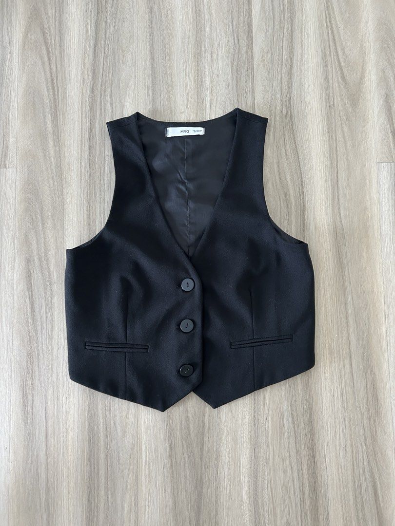 Mango Black Vest/Waistcoat Top (Category: Sleeveless) located in Taguig. Submitted by prelovedcloset2 (Listing ID 1439188278, Image 2). Description: - Mango black vest - V-neck design - Three-button closure.